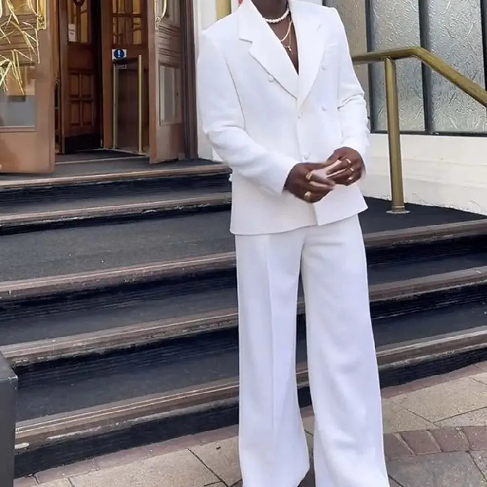 Close-up of the white suit's sharp lapels and tailored fit.
