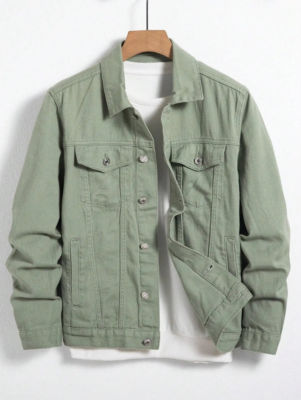 Green denim jacket with turn-down collar and chest pockets for a polished look.