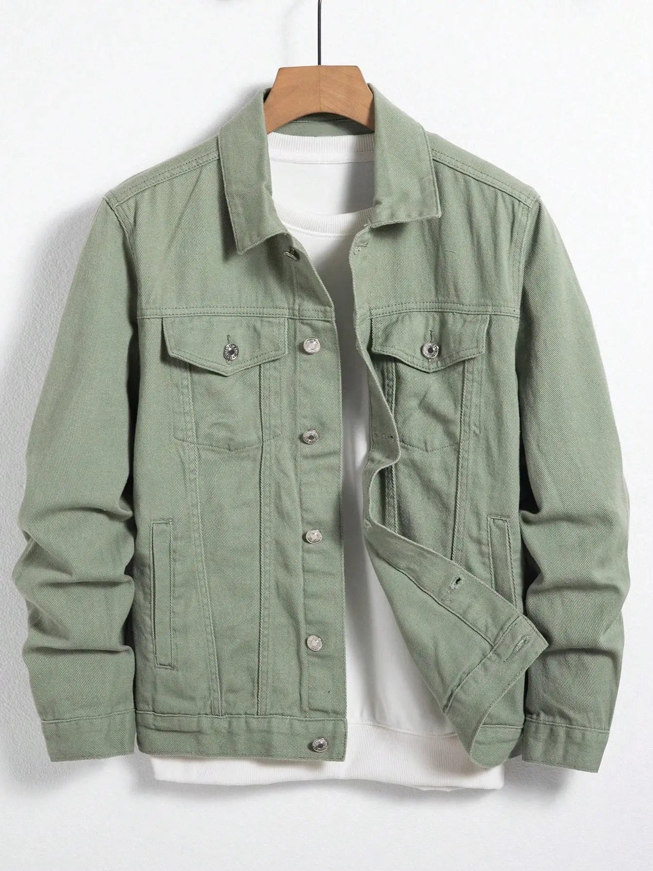 Green denim jacket with turn-down collar and chest pockets for a polished look.