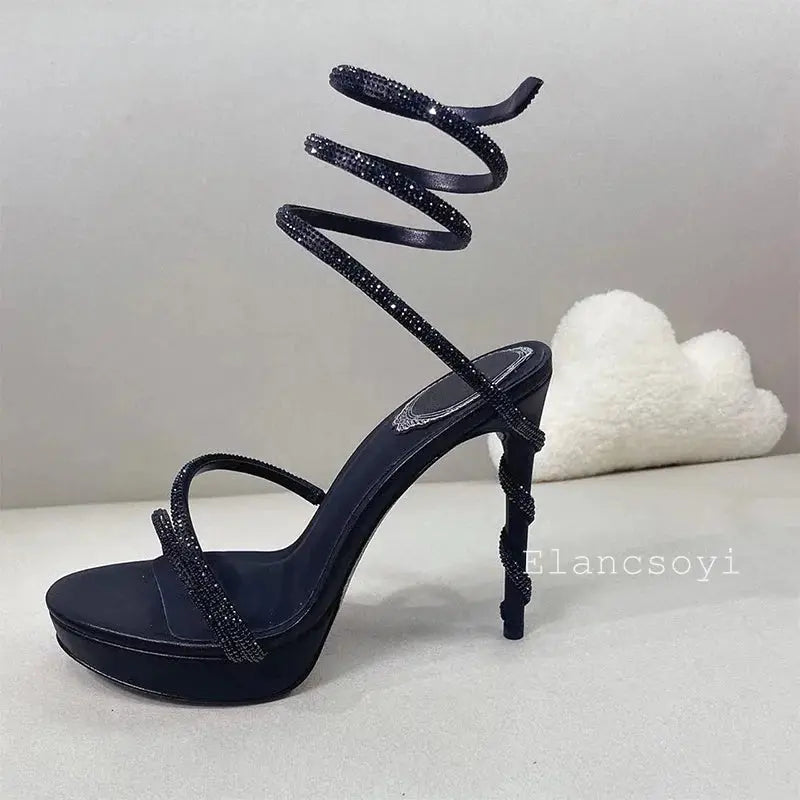 Stiletto heels placed on a luxurious fabric background, emphasizing glamour.