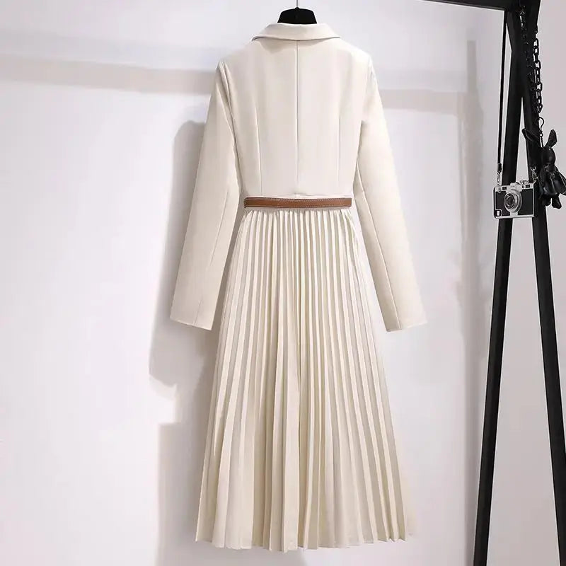 Sophisticated women's suit dress showcasing a flattering draped design for a commanding presence.