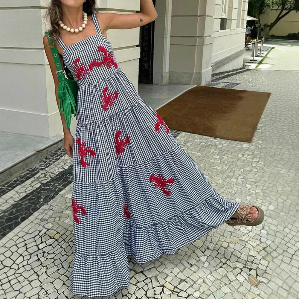 Sunset Soirée Midi dress with playful lobster embroidery on a chic plaid backdrop.