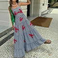 Sunset Soirée Midi dress with playful lobster embroidery on a chic plaid backdrop.