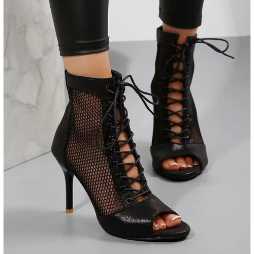 Elegant black mesh heels with ankle straps for starlit events.