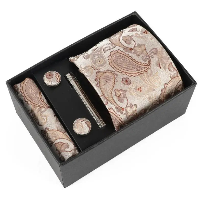 Complete ensemble of silk tie, pocket square, cufflinks, and clip.