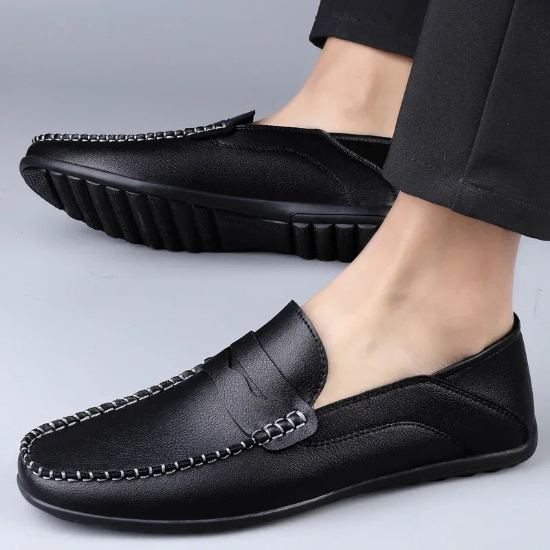 Pair of effortless slip-on loafers in split leather with no-lace design for easy wear