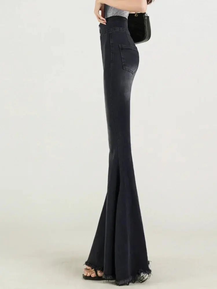Back view of Midnight Whisper Jeans highlighting the flattering silhouette and subtle distressed detail.
