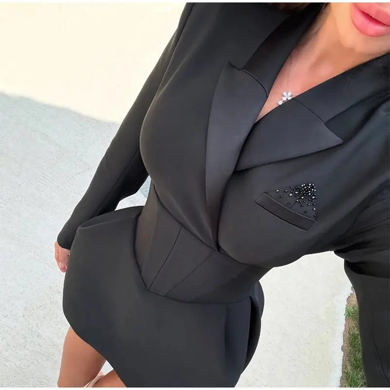 Back view of the mini dress highlighting the elegant silhouette.
