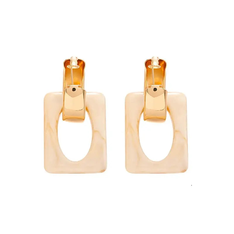 Elegant resin earrings with a modern design, making a powerful fashion statement.