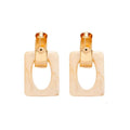 Elegant resin earrings with a modern design, making a powerful fashion statement.