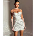 Elegant black crystal sheath dress with spaghetti straps and scoop neckline.