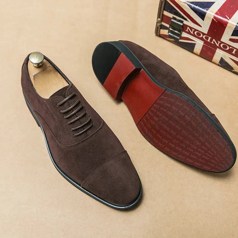 Handcrafted suede leather oxfords in rich brown, showcasing a sleek pointed toe design.