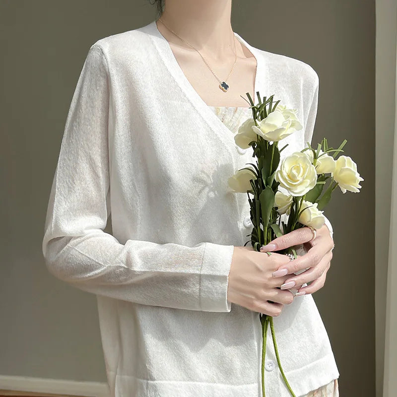 Breeze Whisper Cardigan in a natural setting, highlighting its all-season style and breathable luxury.