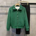 Cardigan displayed on a hanger, emphasizing its sleek design and adaptability.