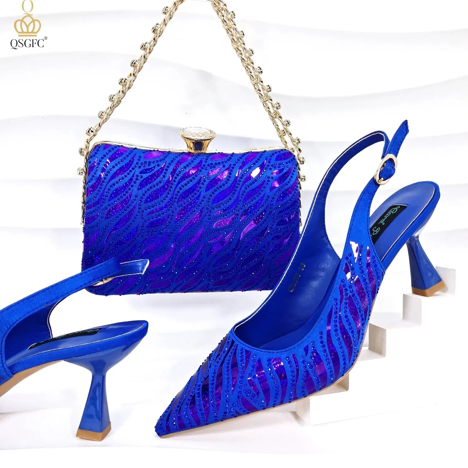 Golden Gala Nights clutch featuring a long chain strap for easy carrying.