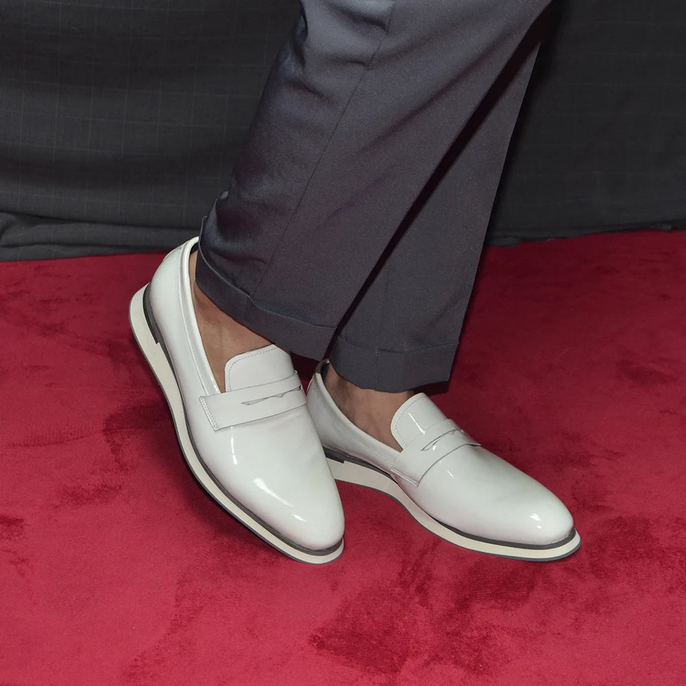 Black patent loafers paired with coordinating silk tie