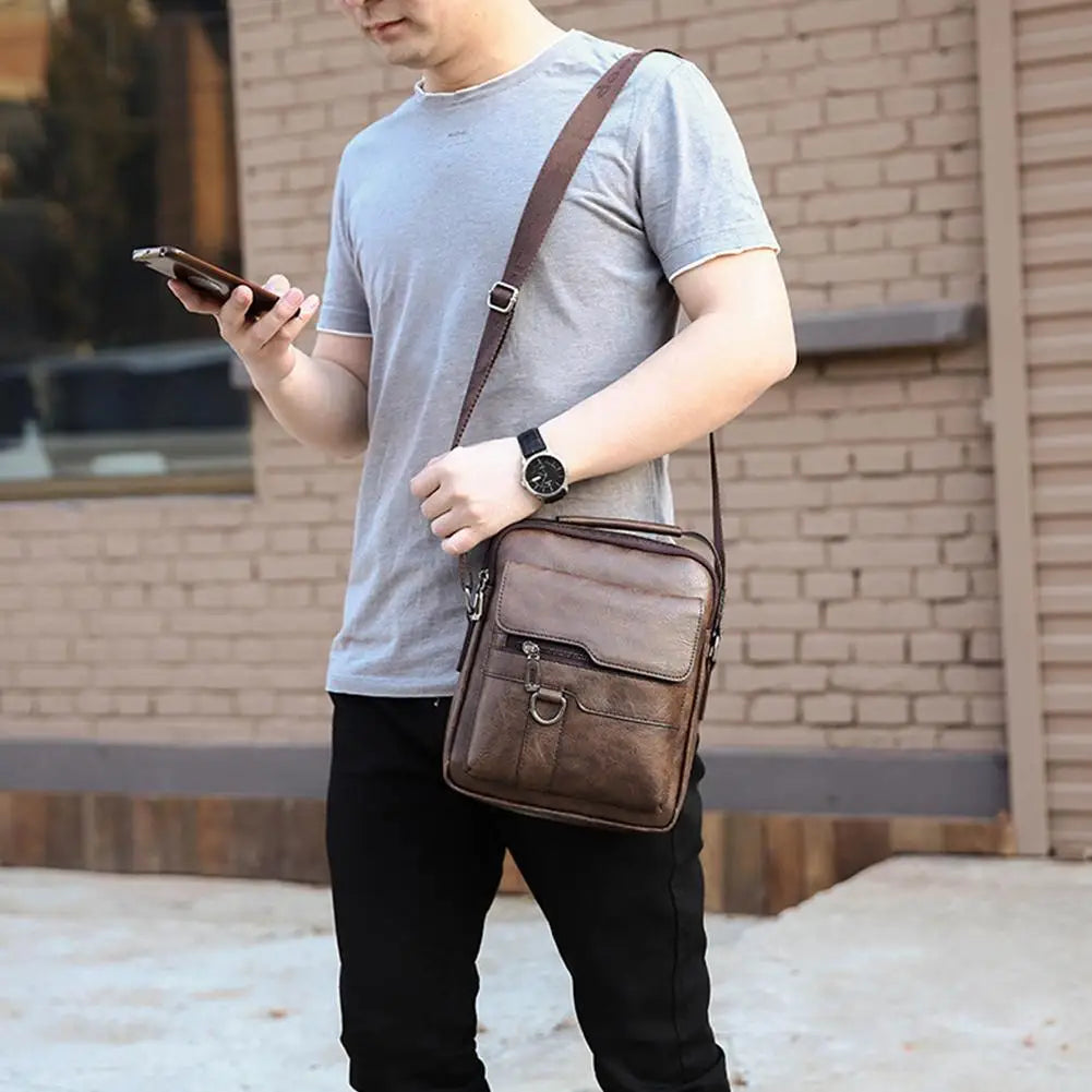 Vintage PU leather messenger bag with shoulder strap adjusted for comfortable crossbody wear