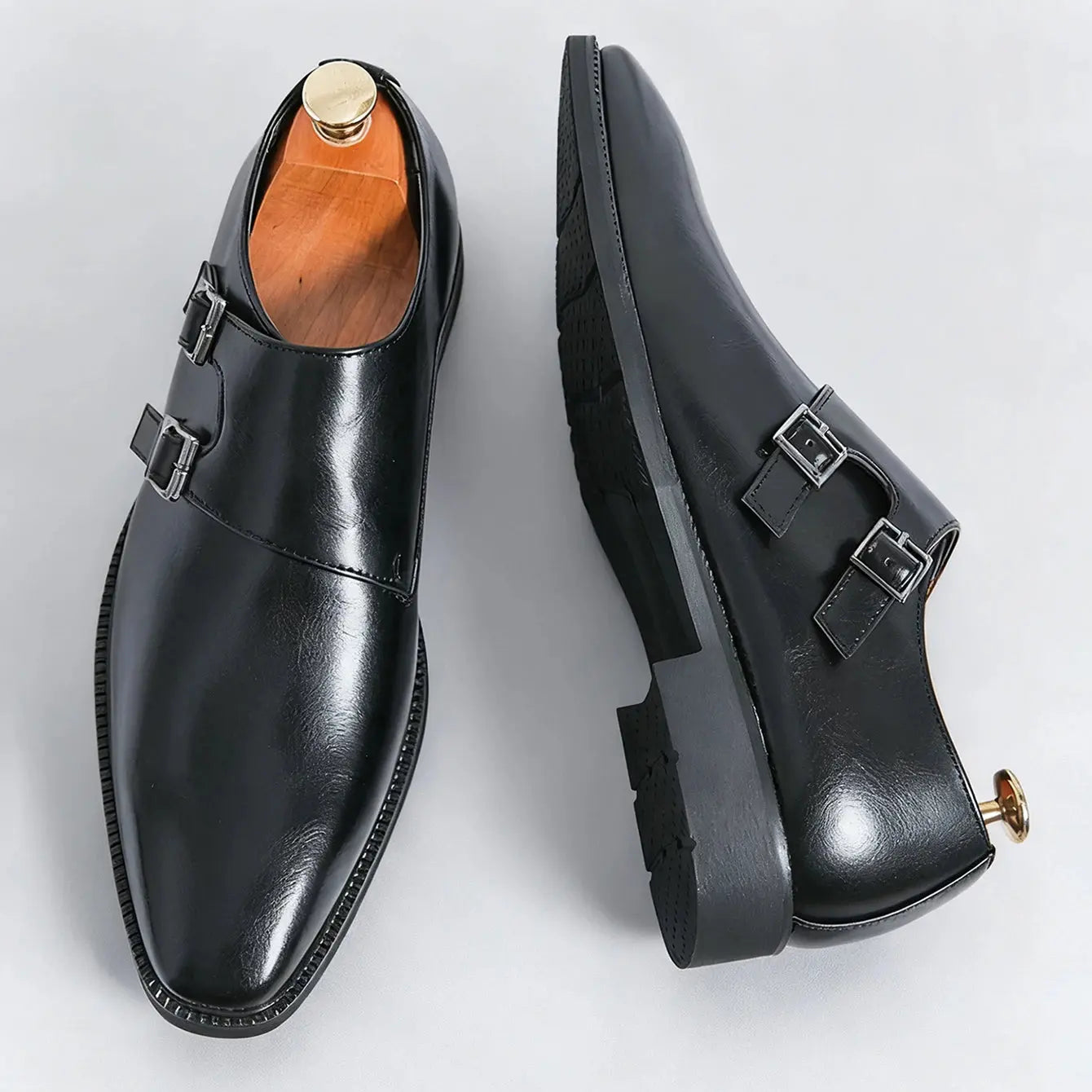 Close-up of the pointed toe of the monk strap leather shoes showcasing premium faux leather.