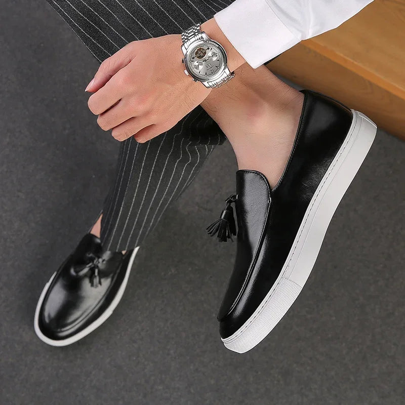 Men's elegant leather loafers showing premium stitching detail