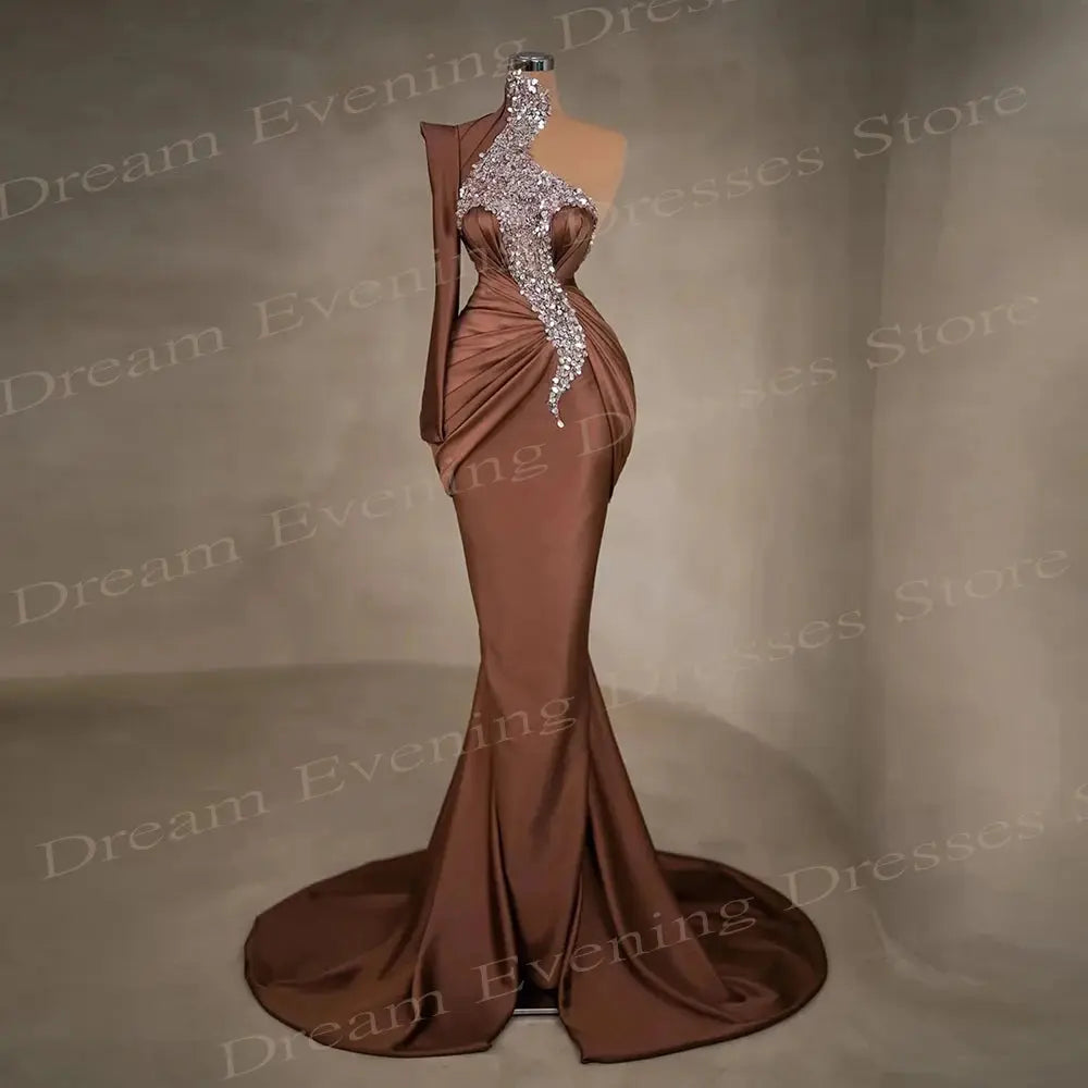 One-shoulder satin evening gown in elegant mermaid silhouette with delicate sequins and high neck design.