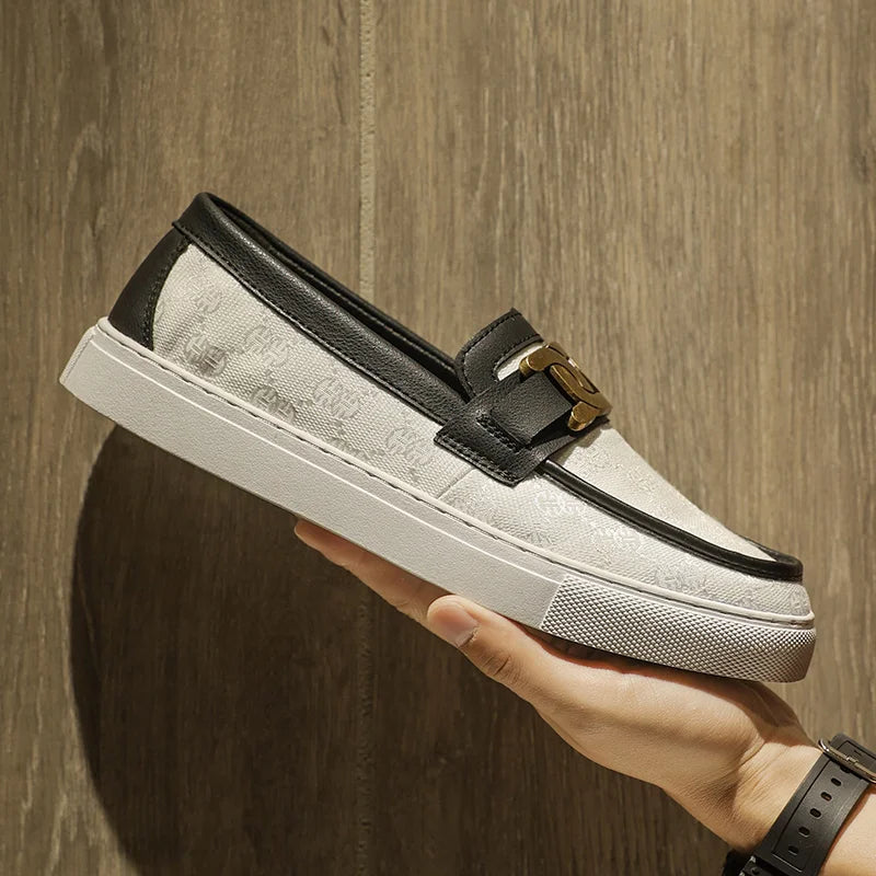 Versatile leather loafers for men featuring metal detailing and waterproof finish