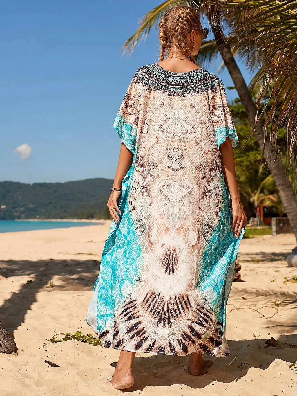Breeze Whisper Kaftan displayed on a hanger, showcasing its lightweight fabric perfect for summer.