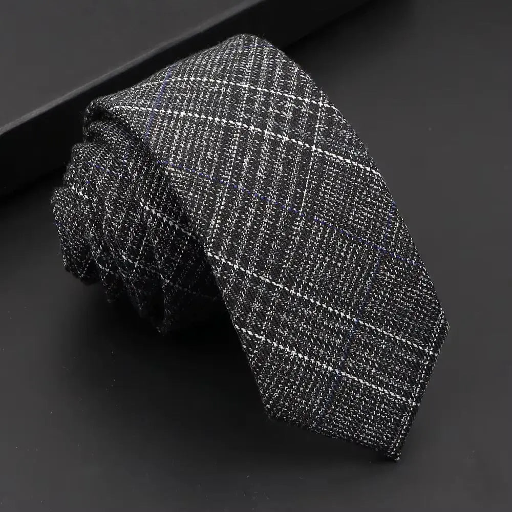 Classic black tie with a contemporary twist, perfect for formal wear.