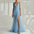 Breathtaking tulle gown with a daring high slit, ideal for elegant evening events.