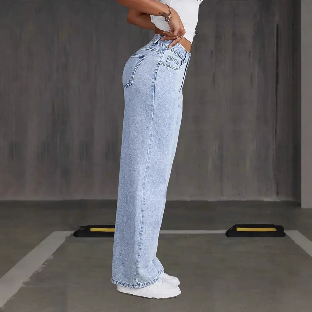 Model wearing wide-leg denim comfort pants, styled for casual chic look.