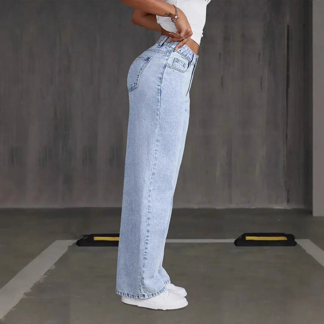 Model wearing wide-leg denim comfort pants, styled for casual chic look.