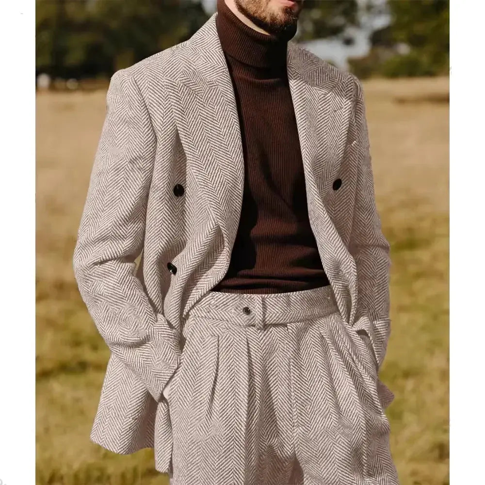 Model showcasing the versatility of the herringbone suit at a cocktail party.