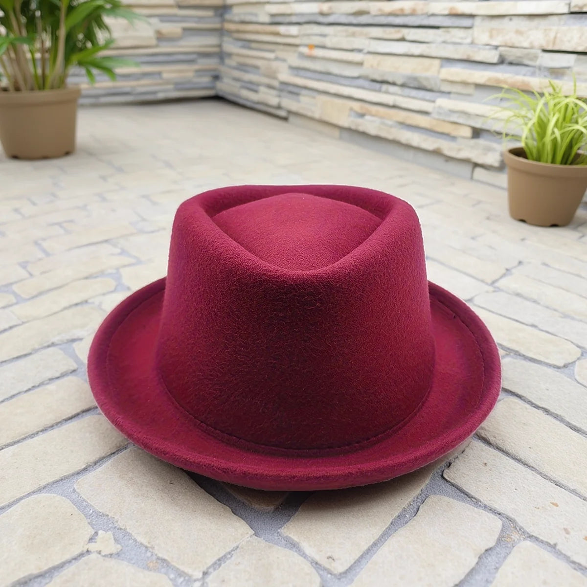 Model wearing the charismatic fedora, turning heads at a chic soirée with its distinctive style.