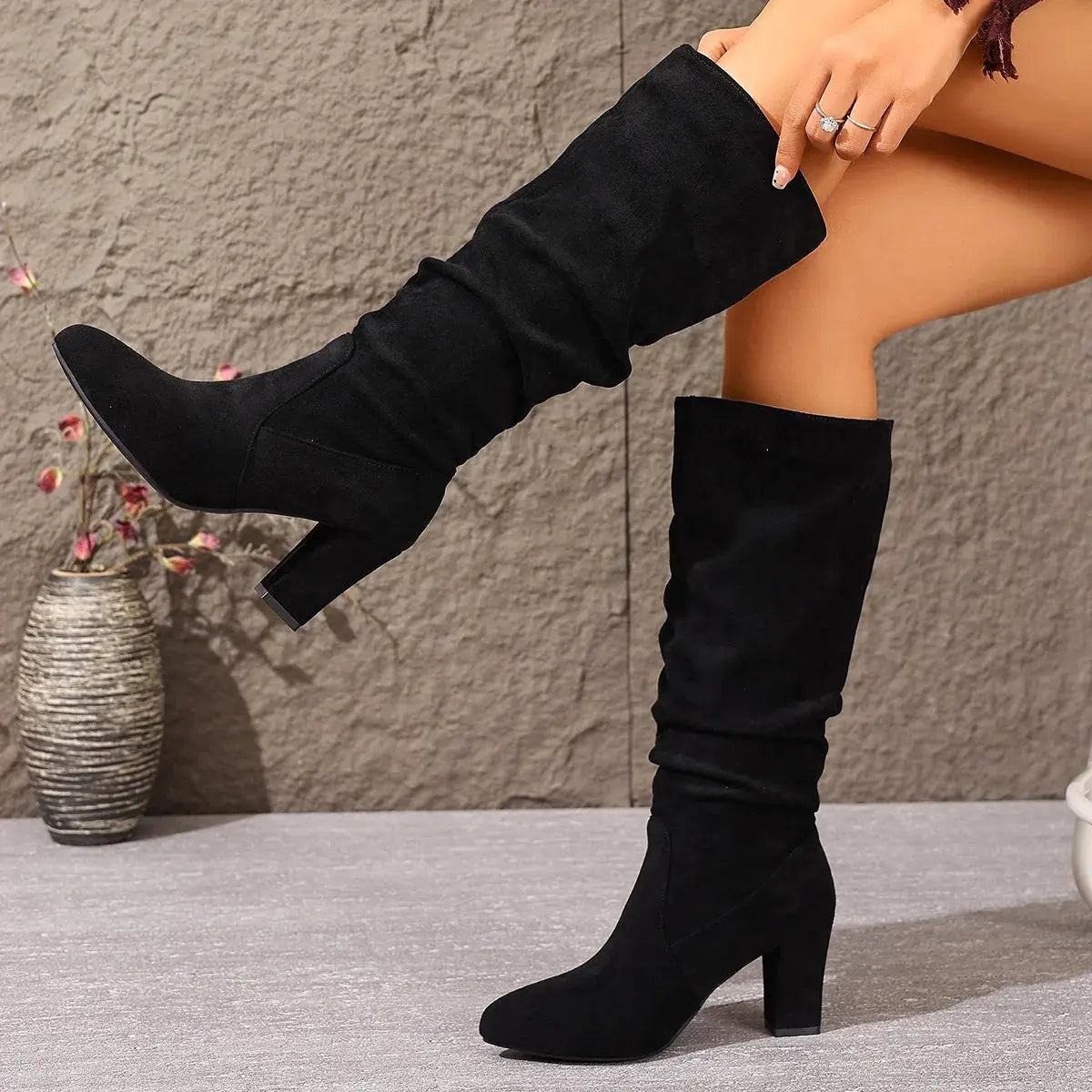 Fashion statement boots in classic black, ideal for boardroom meetings.