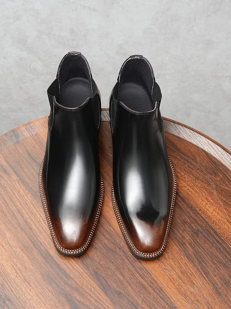 Men's black leather Chelsea boots with polished finish perfect for boardroom and business wear
