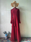 Side angle of the Abaya, showcasing the sheath silhouette and cultural resonance.