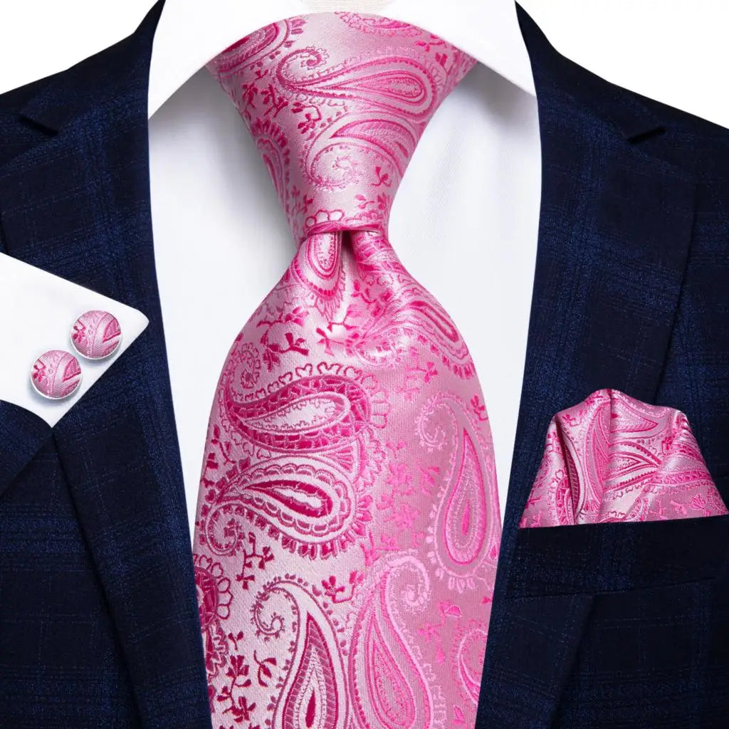 Elegant men's accessory trio with intricate paisley design tie and coordinating cufflinks
