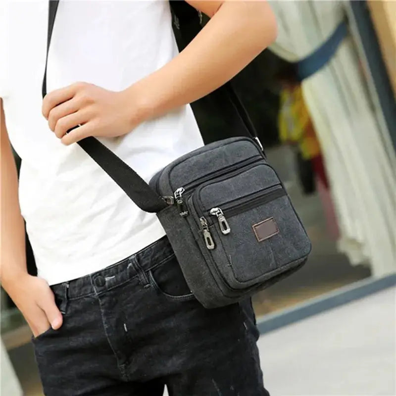 Waterproof canvas crossbody bag with multiple compartments and zipper pocket for everyday essentials