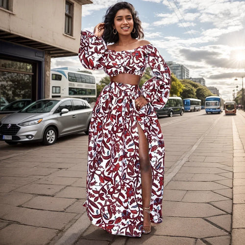 Woman wearing elegant slash-neck top and slit skirt ensemble with African-inspired patterns