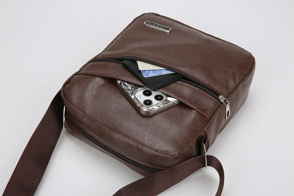 Black messenger bag with smart compartments organizing devices and valuables efficiently