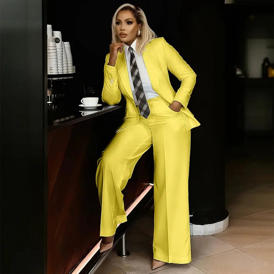 Woman in a white suit set, ready for a corporate meeting.