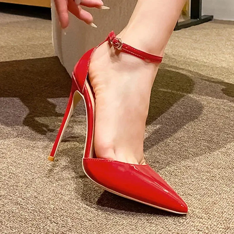 Black leather stiletto heels with ankle straps for elegant style.
