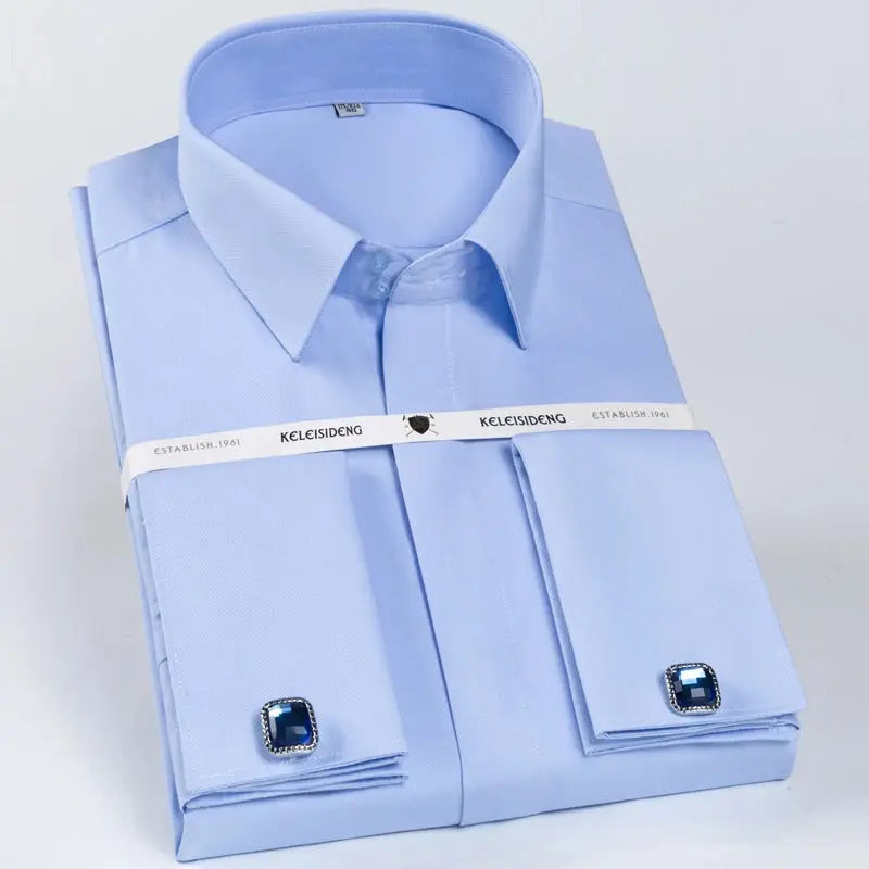 Flat lay of white dress shirt with cufflinks, ideal for business attire.