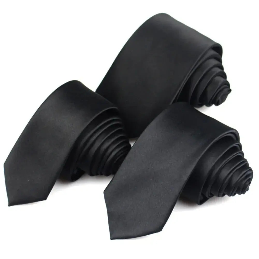 Close-up of a luxurious black tie showcasing its refined texture and durable fabric.