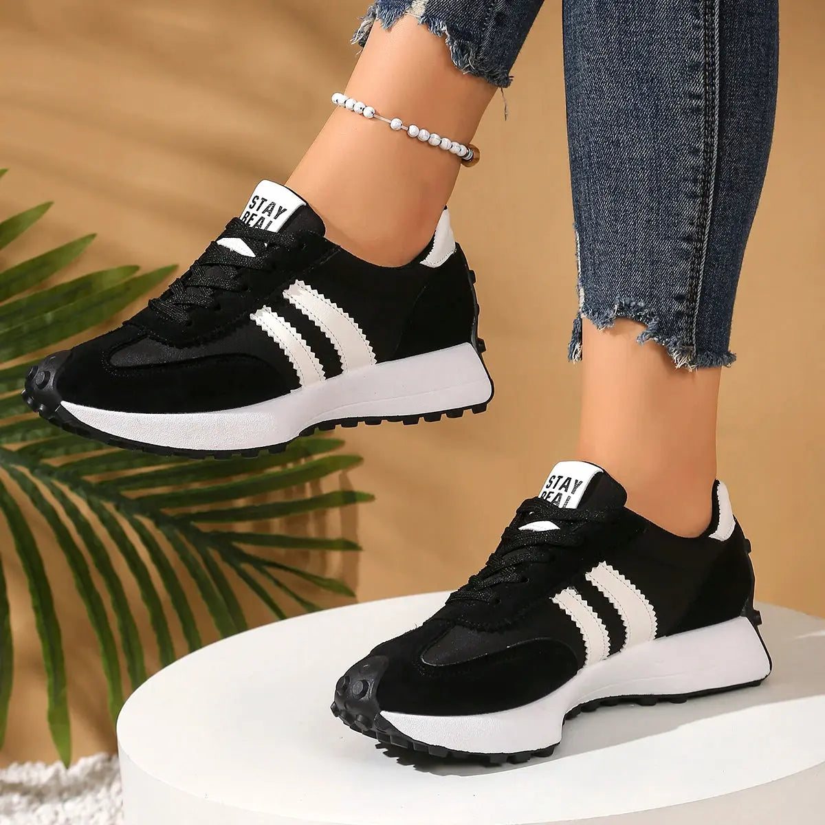 Stylish navy blue sneakers designed for modern women, perfect for casual outings.