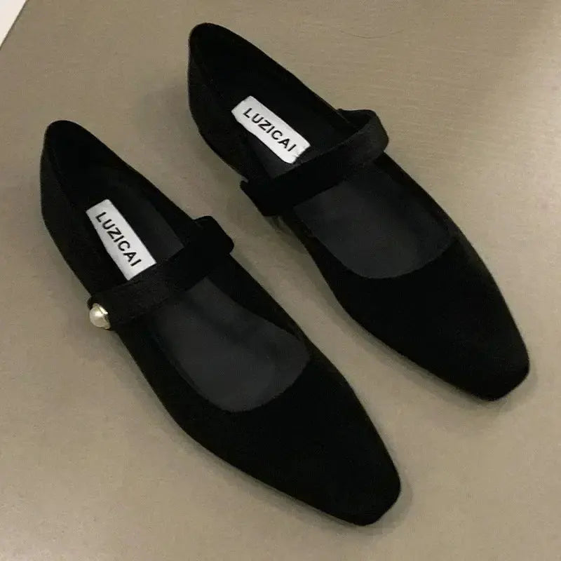 Elegant ballet flats in a casual setting, perfect for spring fashion and versatile wear.