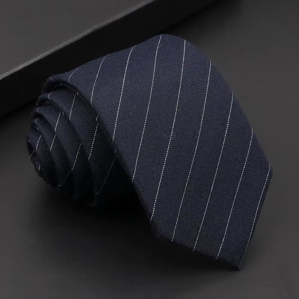 Timeless solid black necktie, perfect for any formal attire.