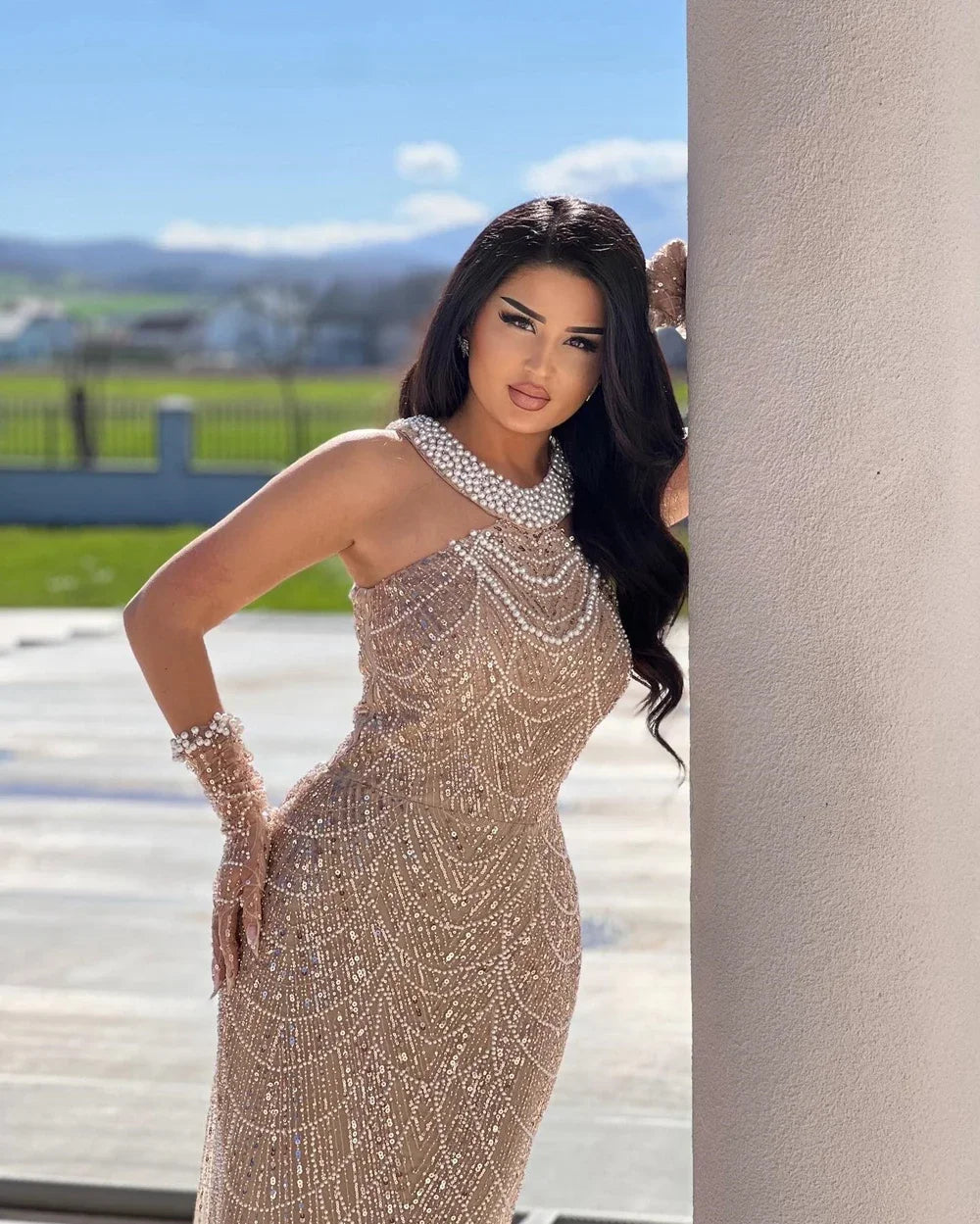 Model showcasing the fitted silhouette and natural waistline of the evening gown.