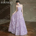 Enchanting lilac gown with strapless design and hand-placed 3D flowers, crafted from soft tulle.