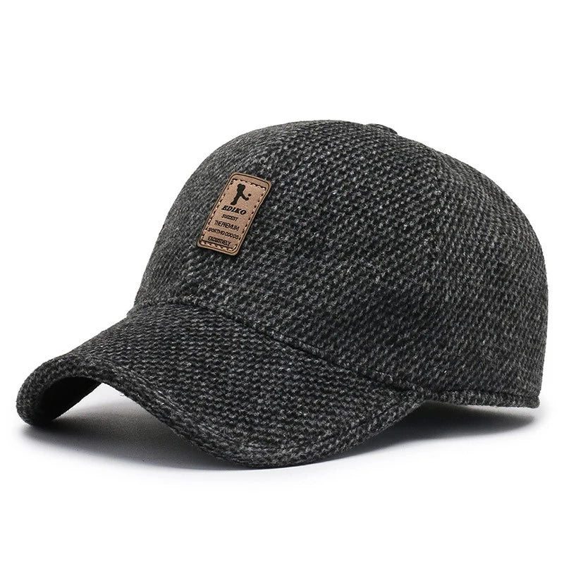 Side view of Chill-Proof Cap with earmuffs, demonstrating weather-resistant design.
