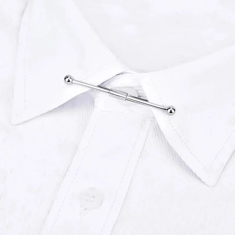Close-up of elegant tie clip, highlighting meticulous craftsmanship and shine.